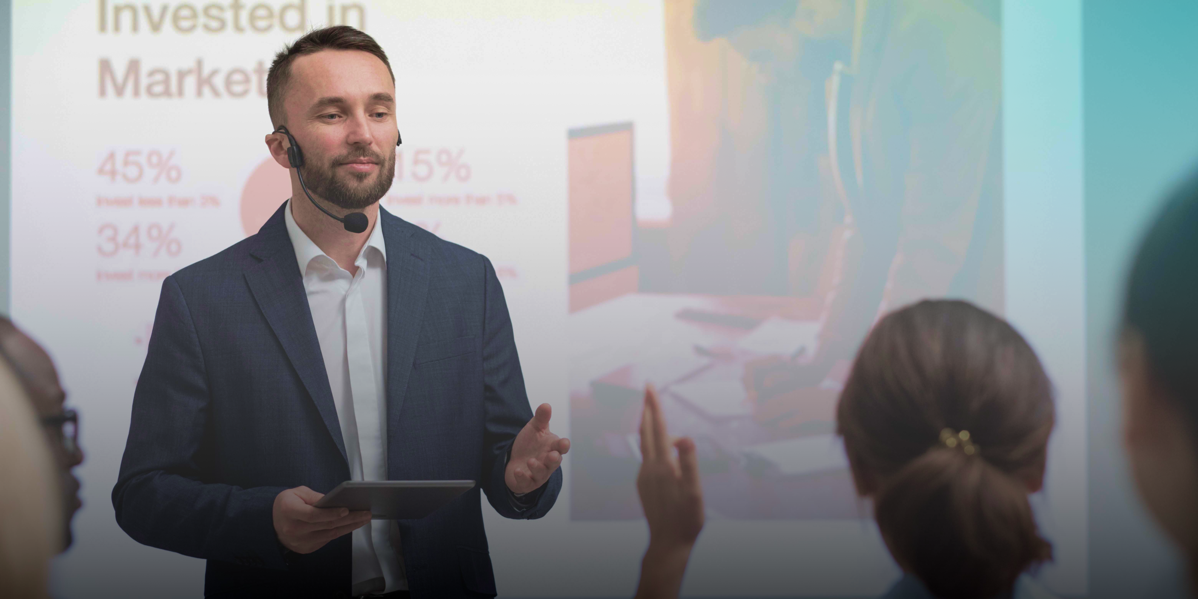 Professional Presenter Speaking to Audience in Corporate Setting