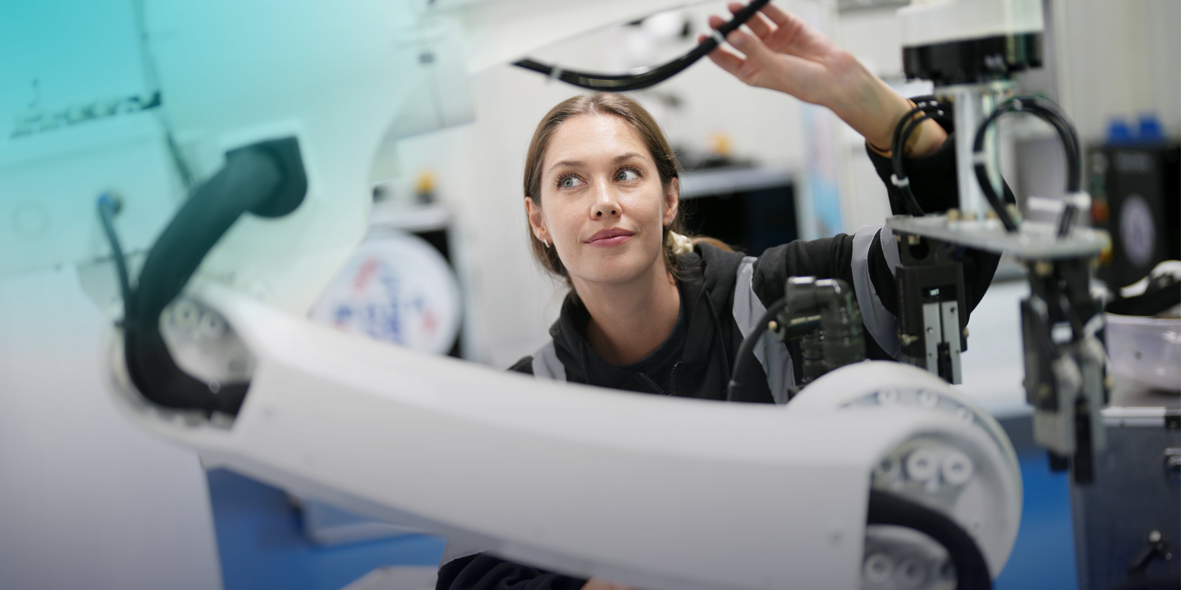Woman Working with High Tech Robotic Arm
